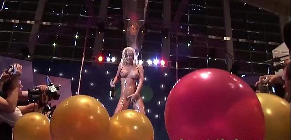  busty oiled Milf on public show stage